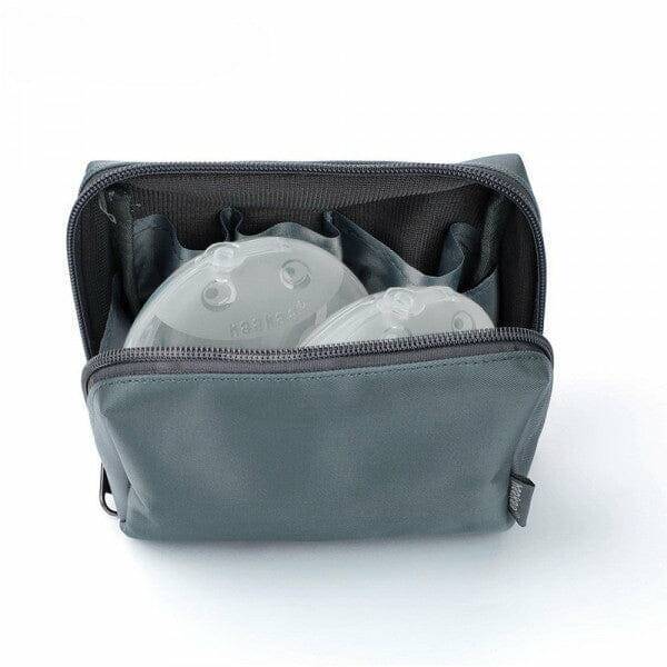 Haakaa 2x Ladybug Breast Milk Collector set in a grey storage bag, featuring two 150ml collectors neatly organized inside.