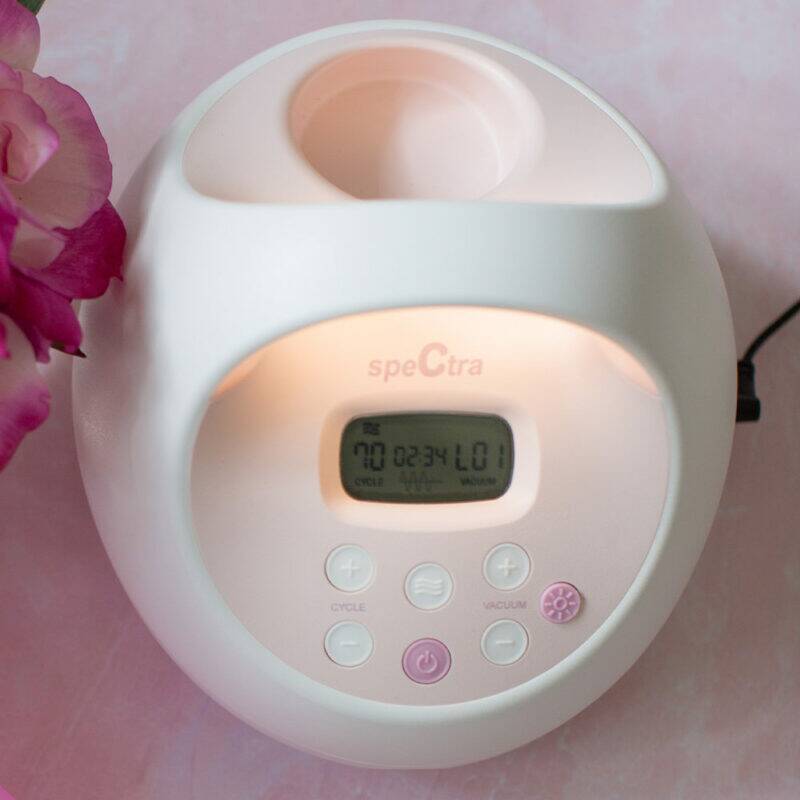 Spectra S2 Plus Double Electric Breast Pump in white and pink with a digital display and control buttons, set on a pink