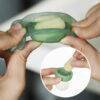 Haakaa Freeze-N-Feed Mini Combo in pea green, showcasing hands holding the product with frozen food inside.
