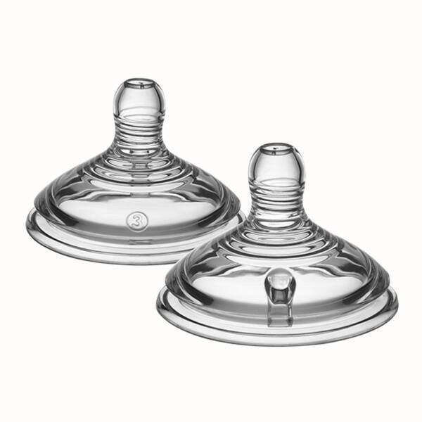 Tommee Tippee breast pump set featuring two clear silicone nipples with textured surfaces for enhanced feeding.