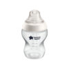 Tommee Tippee clear baby bottle with white lid, featuring measurement markings and a star design for easy feeding.