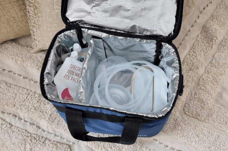 Spectra Handsfree Cup Set in a blue insulated bag, featuring tubing and ice packs, ideal for on-the-go breastfeeding.