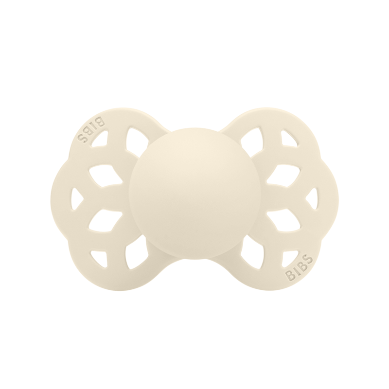 BIBS Infinity Pacifier in Blush and Vanilla, size 1, features a symmetrical design with a floral pattern.