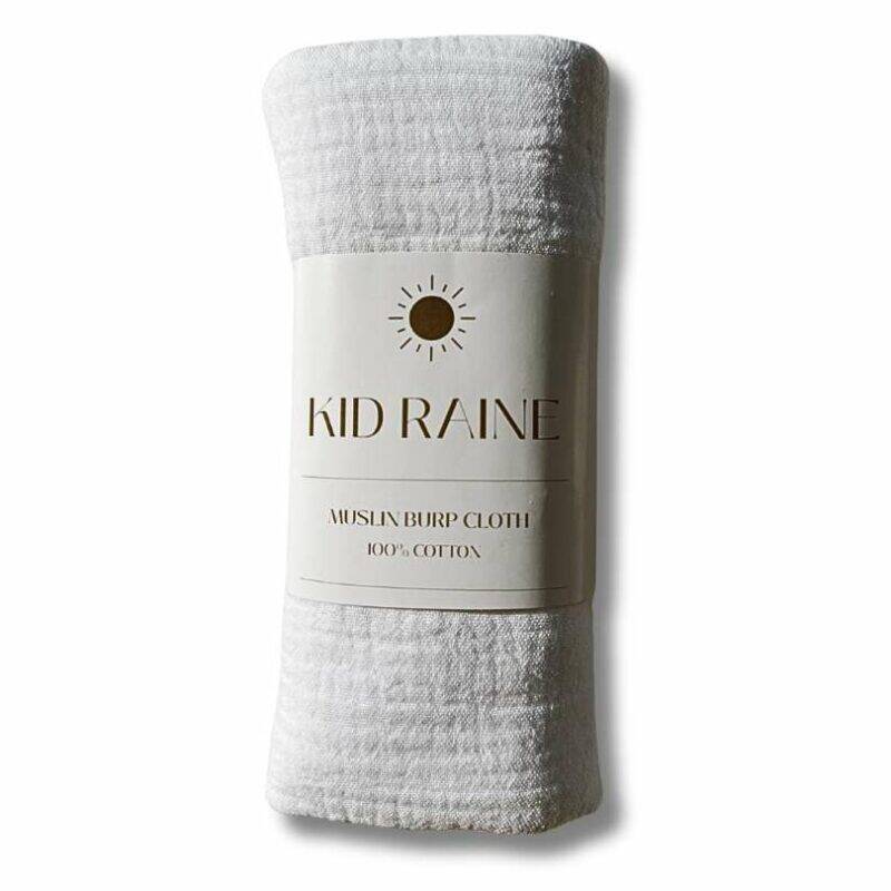 Kid Raine muslin towel-lined burp cloth in white, featuring a soft texture and 100% cotton material.