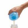 Munchkin Formula Dispenser in blue, pouring formula into a bottle, showcasing its convenient design for feeding.