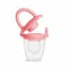 Munchkin Silicone Baby Food Feeder in pink with a clear container and a safety cap for easy feeding.