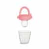 Munchkin Silicone Baby Food Feeder in pink, showcasing the feeder above a clear glass cup for context.