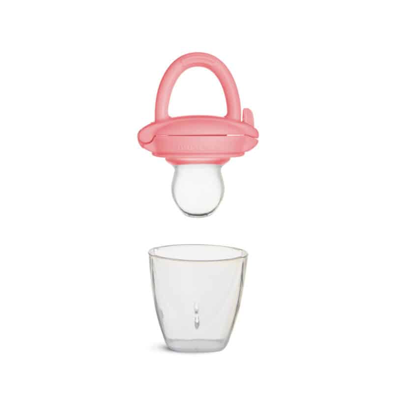 Munchkin Silicone Baby Food Feeder in pink, showcasing the feeder above a clear glass cup for context.