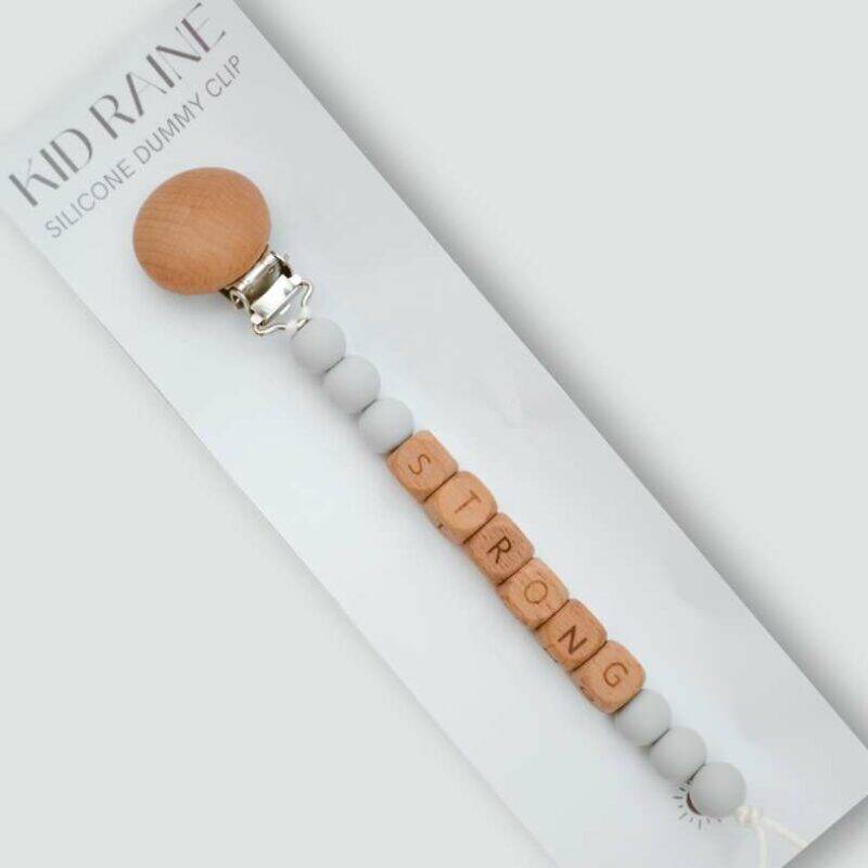 Kid Raine Affirmations Dummy Clip Set featuring a wooden clip with silicone beads in blues, neutrals, and pinks.
