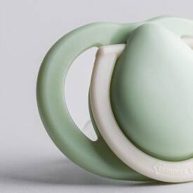 Tommee Tippee Newborn Soother 0-2m in sage green, featuring a soft, rounded design for comfort.
