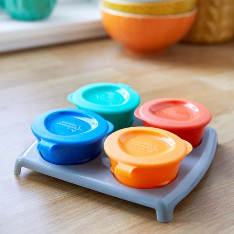 Tommee Tippee Pop Up Freezer Pots in blue, orange, and teal on a gray tray, ideal for storing baby food.