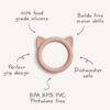 Blush cat-shaped teether from FRIGG + Mushie, made of food-grade silicone, features a perfect grip design and is dishwasher