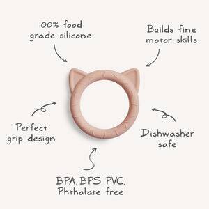 Blush cat-shaped teether from FRIGG + Mushie, made of food-grade silicone, features a perfect grip design and is dishwasher