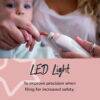 Tommee Tippee Baby & Toddler Nail Trimmer with LED light, shown in use on a child's fingernail for safe filing.