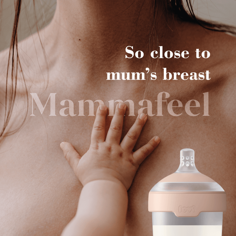 Difrax LOVI Mammafeel Bottle (150ml) with a soft pink cap, held close to a mother's chest, emphasizing bonding.