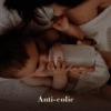 Difrax LOVI Mammafeel Bottle (150ml) in soft pink, designed for anti-colic, held by a baby in a cozy setting.