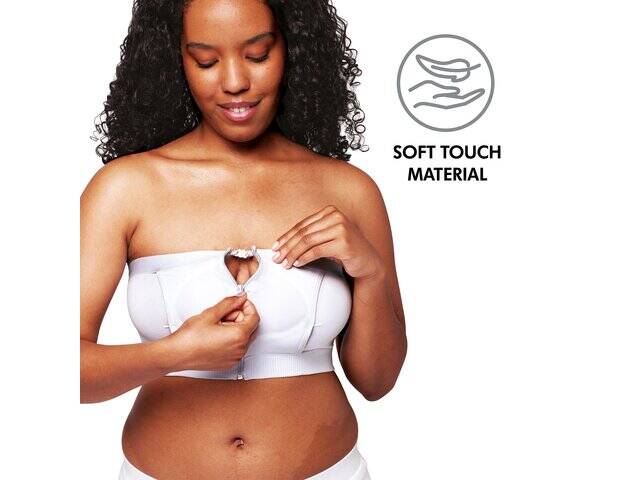 Medela Hands-Free Pumping Bustier in white, featuring soft touch material and adjustable front clasp, worn by a smiling