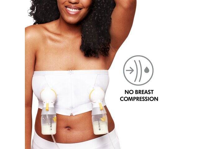 Medela Hands-Free Pumping Bustier in white, size L, worn by a woman with curly hair, showing dual pump setup without breast