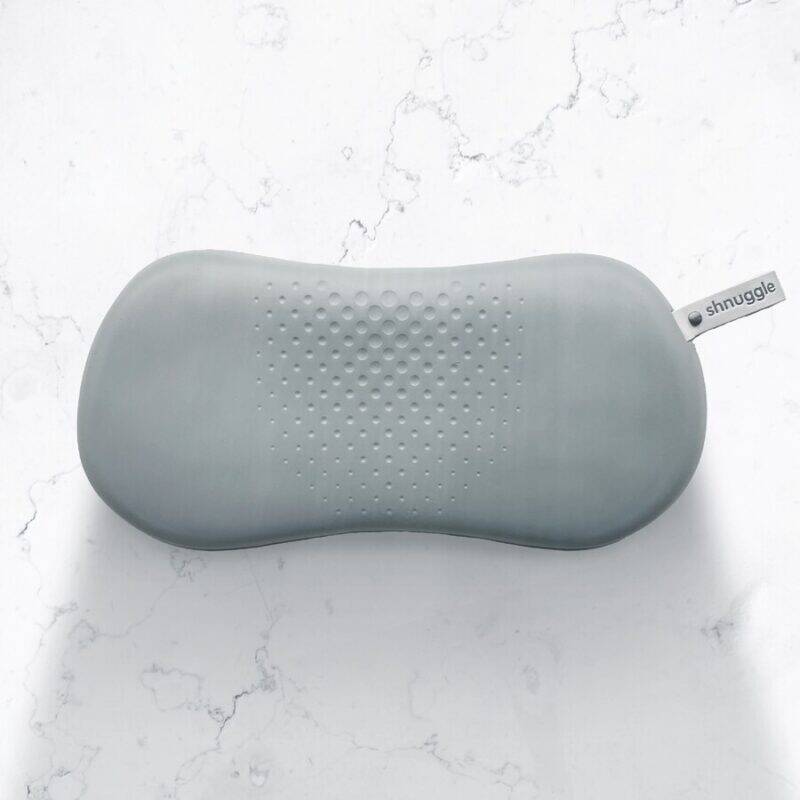Shnuggle Kneeler in soft grey with a textured surface for comfort, designed for easy kneeling during baby care.