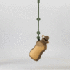Maccie Anti-Drop Chain in beige, featuring a unique bottle design, suspended from a green attachment.