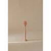 Mushie Silicone Baby Bottle Brush in blush, featuring a flexible bristle head for effective cleaning.