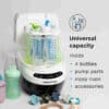 Baby Brezza Bottle Washer Pro in white and green, designed to hold 4 bottles, pump parts, and accessories.
