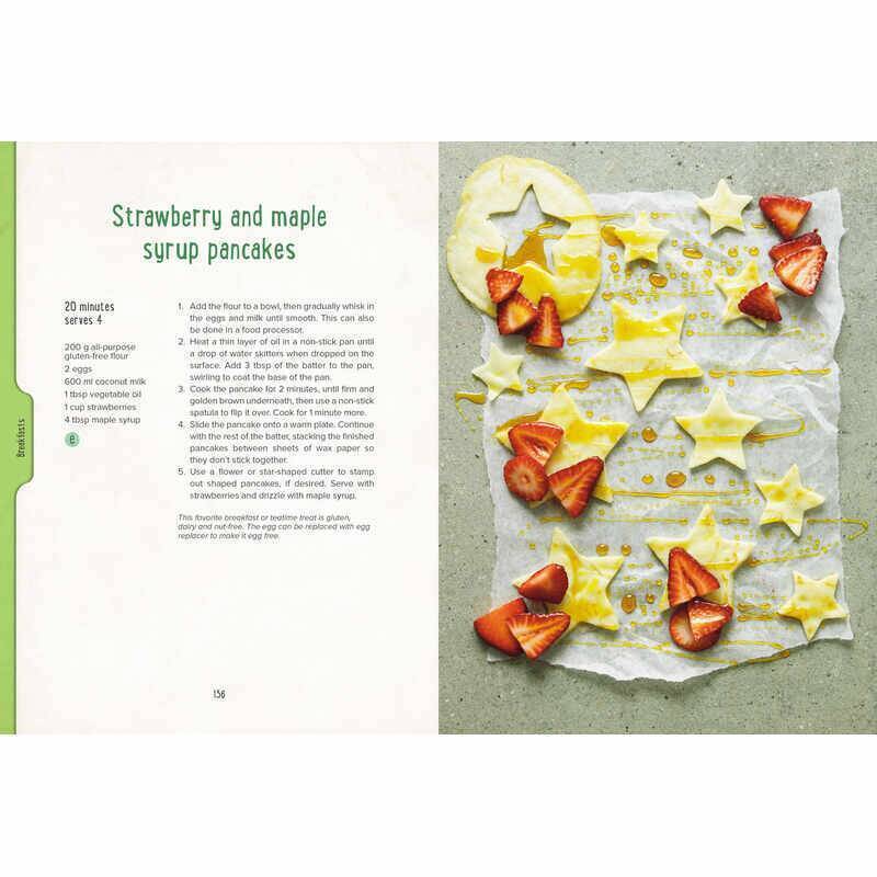 Allergy Sense book open to a recipe page featuring strawberry and maple syrup pancakes, with colorful fruit decorations.