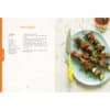 Lamb kebabs recipe page from Allergy Sense book, featuring colorful skewers of meat and vegetables on a yellow plate.