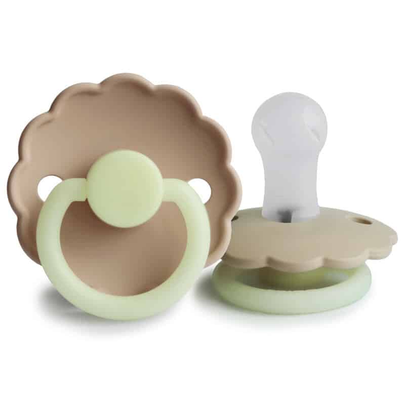 FRIGG Daisy Night Silicone pacifier in Night Blush and Night Cream, featuring a scalloped design and glow-in-the-dark ring.