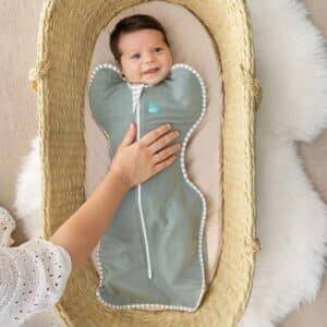 FIB Square Hero (49) in sage green, a snug sleeping bag for infants, featuring a zip closure and soft fabric.