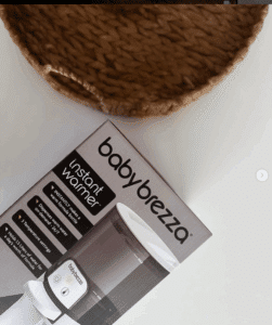 Baby Brezza Instant Warmer, sleek design with a white and gray finish, ideal for quickly warming baby bottles.