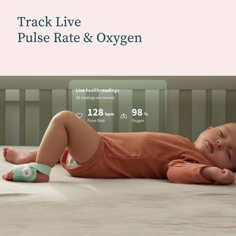Owlet Dream Sock in mint green on a sleeping baby, displaying live pulse rate and oxygen levels on a screen.