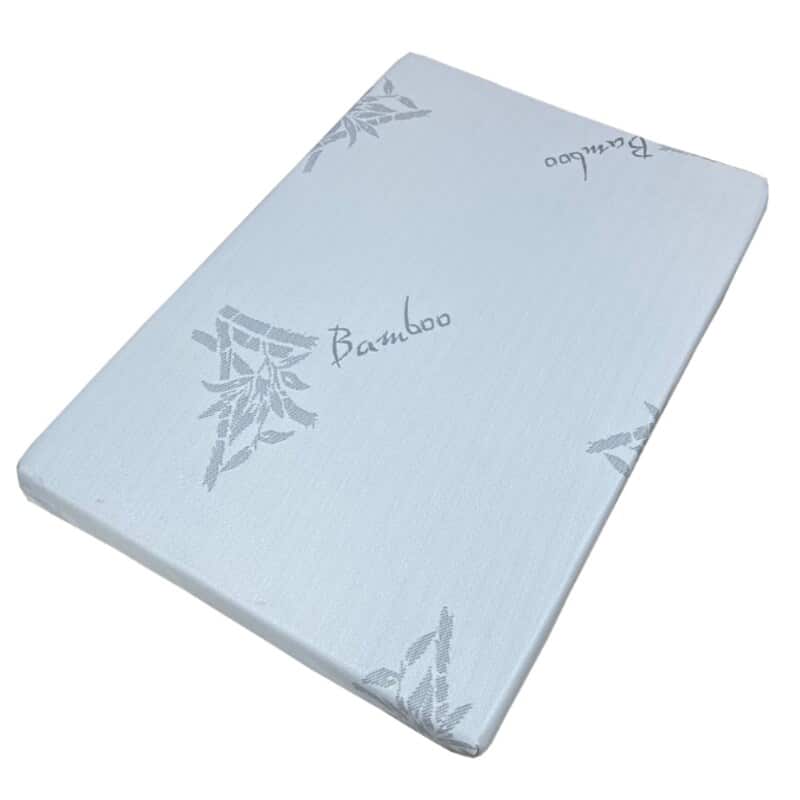 Baby Womb World Bamboo Standard Mattress, soft white with bamboo leaf design, ideal for nursery use.