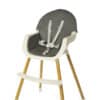 Baby Womb World Grey High Chair with a soft grey seat and wooden legs, featuring a safety harness for secure seating.