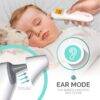 Baby Womb World 3-in-1 thermometer in ear mode, measuring temperature of a sleeping baby on a soft blanket.