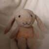Flow Amsterdam Plush Night Light featuring Liva the bunny, soft beige and peach colors, sitting on a cozy surface.