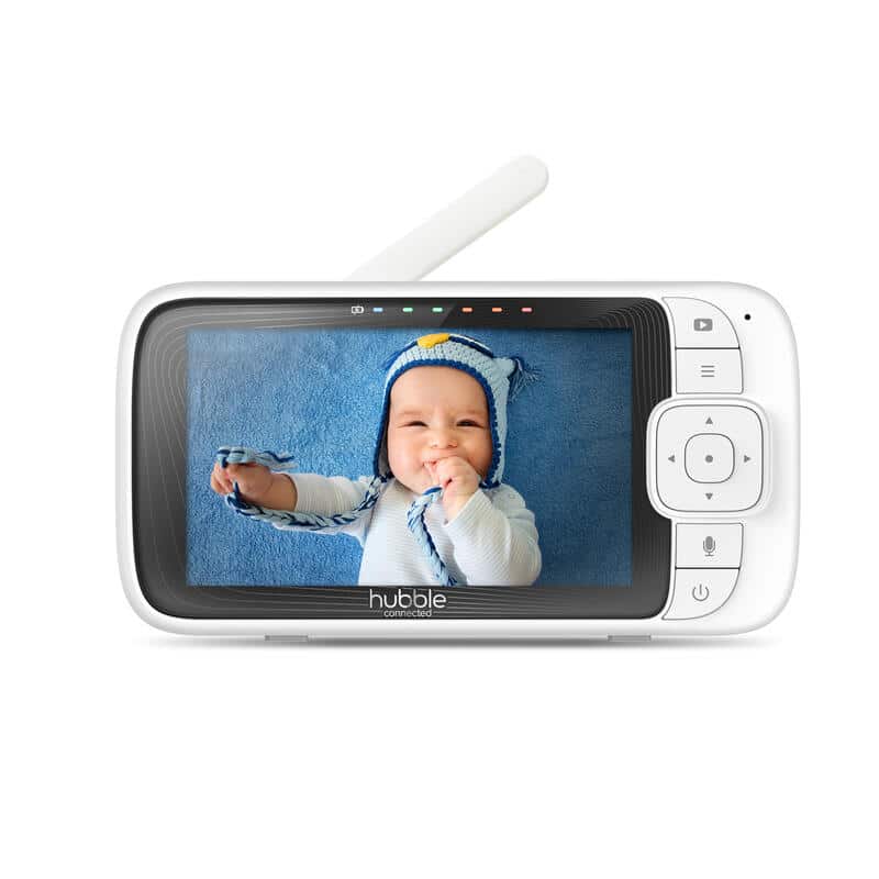 Hubble Nursery Pal Cloud baby monitor displaying a smiling baby in a blue outfit on a soft blue background.