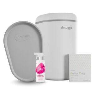 Shnuggle Changing Bundle featuring a gray changing mat, a white diaper bin, cleaning spray, and a pack of disposable bags.