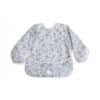Mushie Long Sleeve Bib in blue flowers design, featuring elastic cuffs and a front pocket for easy cleanup.