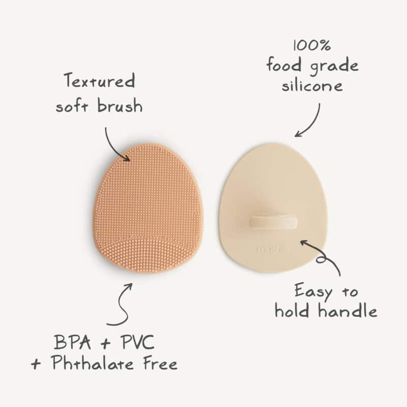 Mushie Baby Bath/Cradle Cap Brush set in blush and sand, featuring textured silicone bristles and easy-to-hold handles.
