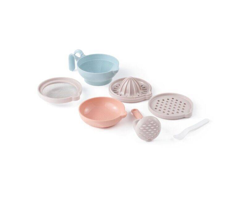 Pigeon Home Baby Food Maker accessories in pastel colors, including a strainer, bowl, juicer, and masher.
