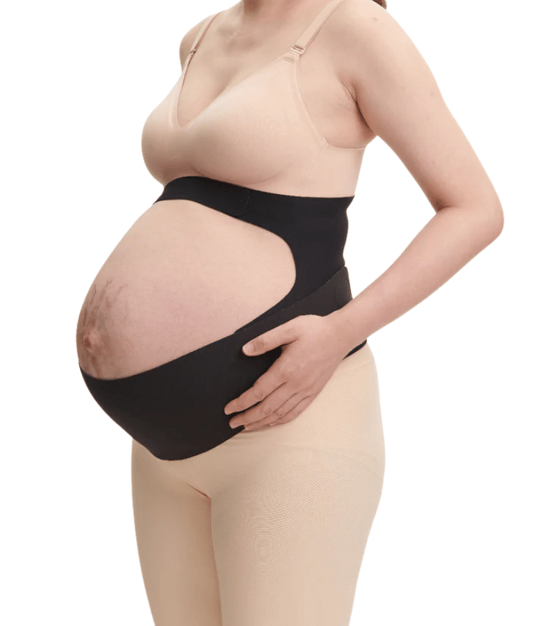 Momcozy Pregnancy Belly Band in black, designed for support with a cut-out feature, worn by a pregnant woman.