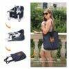 Momcozy Mtwml Portable High Chair in black, shown being carried in a tote bag for easy transport.