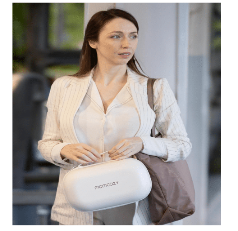Momcozy Wearable Electric Breast Pump M5 in Cozy Red, shown in lifestyle setting with a woman carrying it in a stylish bag.