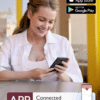 Momcozy Wearable Hands Free Mobile Flow Breast Pump M9 in use by a smiling woman, checking her phone while sitting at a café.