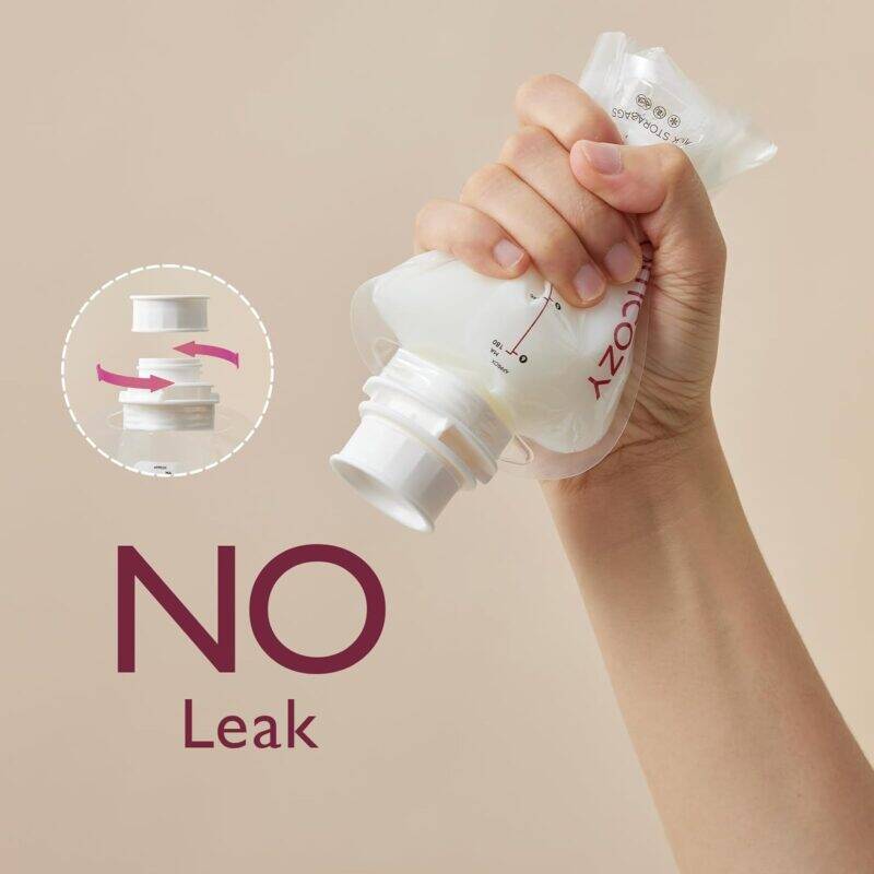 Momcozy Disposable Baby Bottle Kit held in hand, demonstrating leak-proof design with a light background.