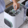 Momcozy Washing Block for KleanPal Pro, 120 detergent tablets, being used in a baby bottle washer with bottles inside.