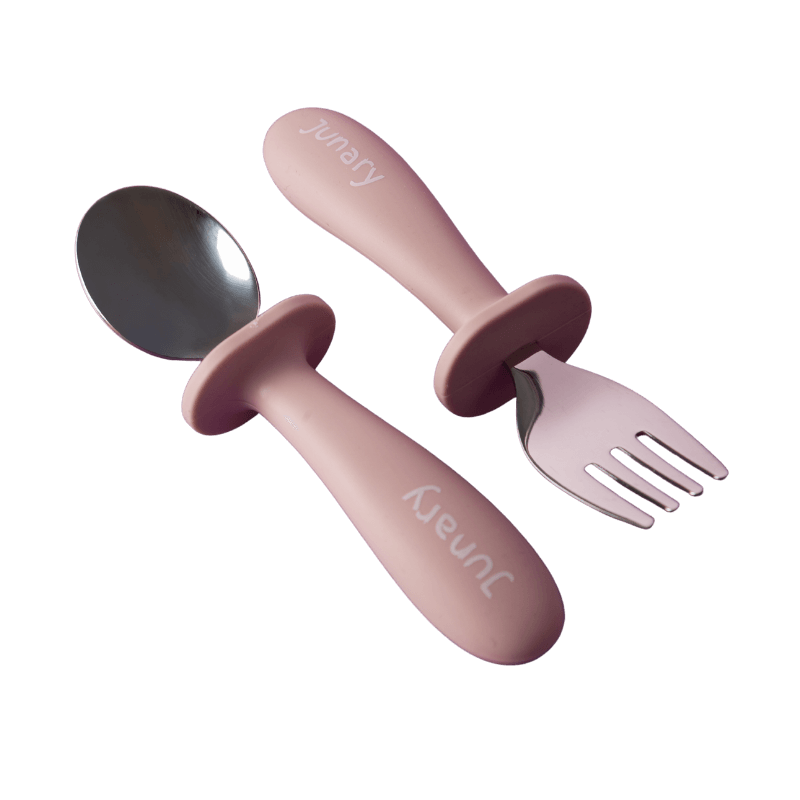 Junary Little Bites Cutlery Duo in soft pink with ergonomic handles, featuring a spoon and fork for easy toddler use.