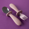 Junary Little Bites Cutlery Duo in pink, featuring a spoon and fork with ergonomic handles for easy grip.