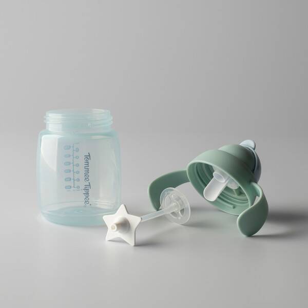 Tommee Tippee Trainer Straw 240ml in neutral color with a detachable straw and star-shaped handles for easy grip.